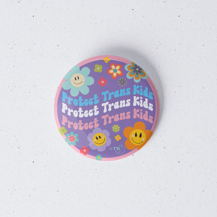 Based in Chicago by queer artist & designer Kayla Pekkala - Tiny Werewolves | Retro Flower Protect Trans Kids 1" Mini Button Pin in | Shop to get your Metal Pinback Button with collections featuring retro-inspired designs infused with social commentary art, highlighting modern social & current events.