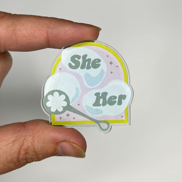 Based in Chicago by queer artist & designer Kayla Pekkala - Tiny Werewolves | She / Her Pronouns Bubble Acrylic Pin in | Shop to get your Acrylic Pin with collections featuring retro-inspired designs infused with social commentary art, highlighting modern social & current events.