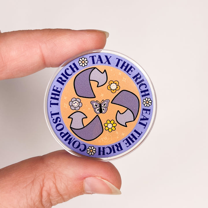 Based in Chicago by queer artist & designer Kayla Pekkala - Tiny Werewolves | Tax | Eat | Compost the Rich Acrylic Pin in Clear | Shop to get your Acrylic Pin with collections featuring retro-inspired designs infused with social commentary art, highlighting modern social & current events.