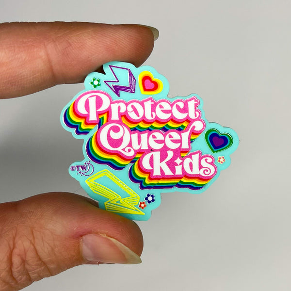 Based in Chicago by queer artist & designer Kayla Pekkala - Tiny Werewolves | Retro Protect Queer Kids Acrylic Pin in Aqua | Shop to get your Acrylic Pin with collections featuring retro-inspired designs infused with social commentary art, highlighting modern social & current events.