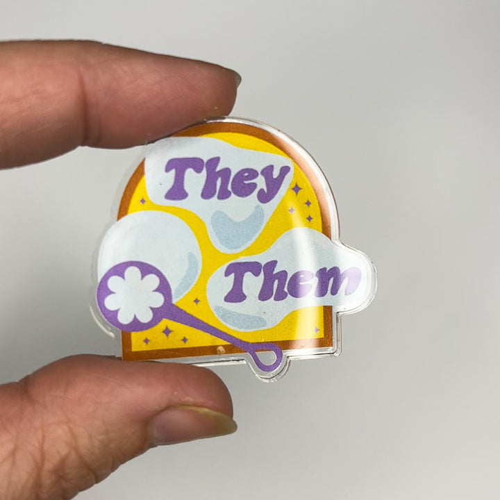 Based in Chicago by queer artist & designer Kayla Pekkala - Tiny Werewolves | They / Them Pronouns Bubble Acrylic Pin in | Shop to get your Acrylic Pin with collections featuring retro-inspired designs infused with social commentary art, highlighting modern social & current events.