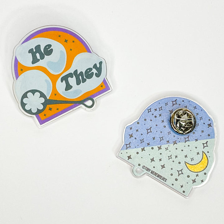 Based in Chicago by queer artist & designer Kayla Pekkala - Tiny Werewolves | He / They Pronouns Bubble Acrylic Pin in Clear | Shop to get your Acrylic Pin with collections featuring retro-inspired designs infused with social commentary art, highlighting modern social & current events.