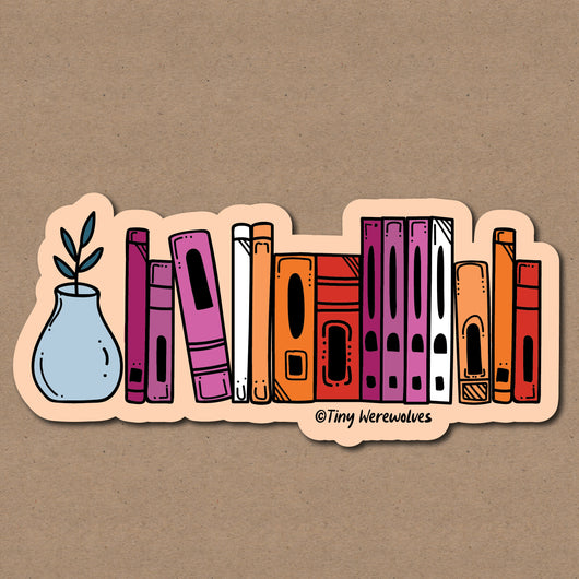 Based in Chicago by queer artist & designer Kayla Pekkala - Tiny Werewolves | Lesbian Bookshelf Pride Sticker in 5" Sticker | Shop to get your Sticker with collections featuring retro-inspired designs infused with social commentary art, highlighting modern social & current events.